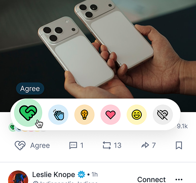 Two smartphones displaying a video review with interactive emoji reaction buttons